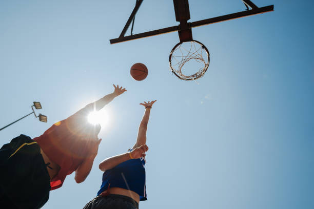 istock Talented men playing basketball in summer 928401326