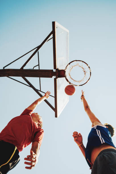 istock Tall guys playing serious basketball game 928401328