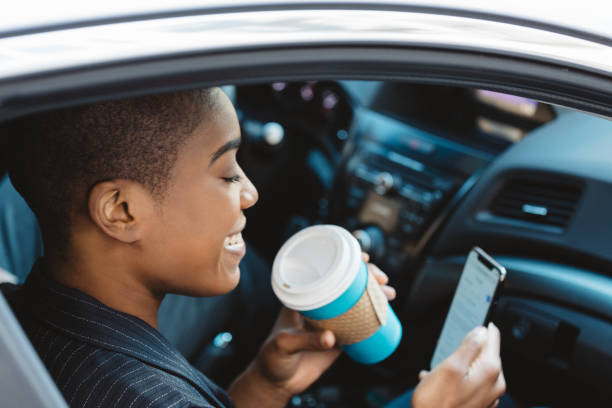 black woman on the phone using rideshare