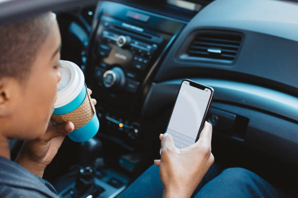 istock black woman on the phone using rideshare 928407386