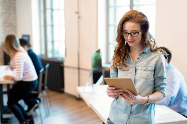 istock Beautiful woman working in modern office 928409494