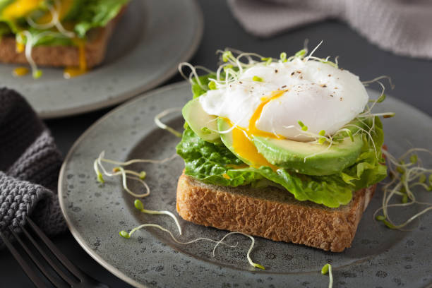 istock breakfast toast with avocado, poached egg and alfalfa sprouts 928410928