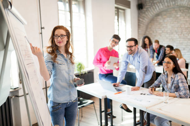 istock Creative young business people and architects working in office 928411168