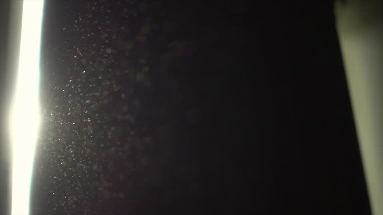 Video of sunlight with dust float in the bed rom super slow motion. 4K