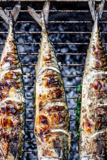 Roasted carcass fish mackerel cooked on the grill, top view, close-up stock photo