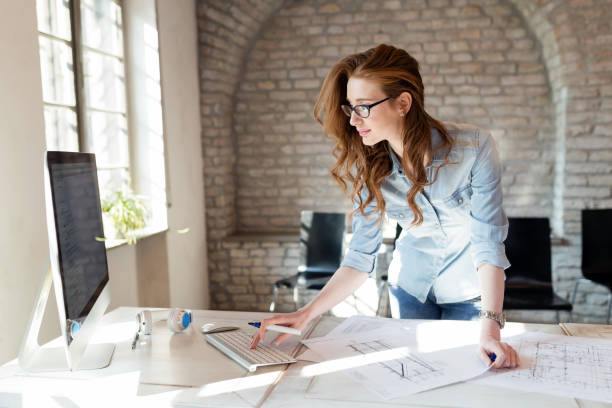 istock Beautiful woman working in modern office 928411636