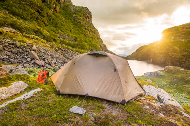 istock tourist tent in mountains summertime sunset Norway 928414606