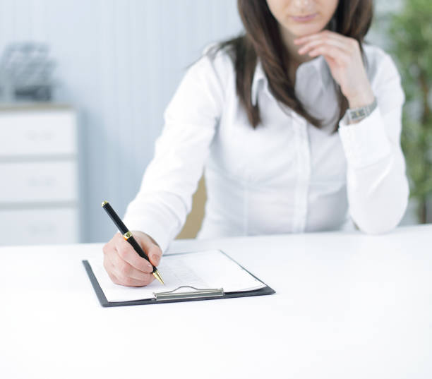 istock modern business woman working with documents in the workplace 928421898