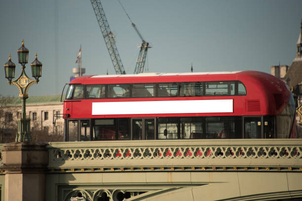 Blank billboard on London bus A modern London bus with a blank billboard banner commercial sign outdoors marketing stock pictures, royalty-free photos & images