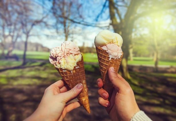 istock Young couple holding ice cream at the sunset. 928426780