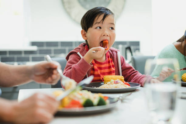 istock Little boy Enjoying his Stir Fry 928426864