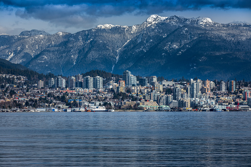 Rocky Mountains and buildings, North Vancouver, British Colombia, Canada.