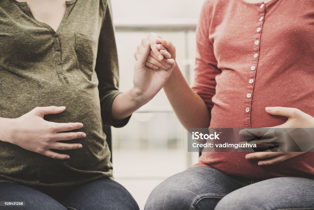 Pregnant women Close-up portrait of bellies of two pregnant women. Pregnant Stock Photo