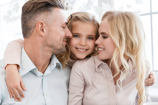 istock happy young family cuddling together 928434624