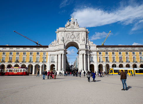 People crossing the Commerce square (Praça do Comércio) on a sunny day of january