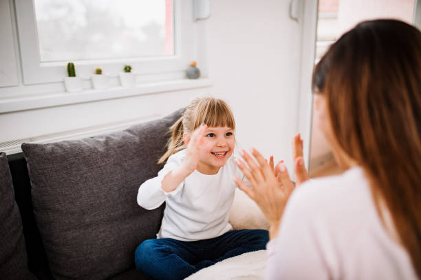 istock Young mother playing with daughter at home. 928442116