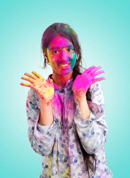 istock girl painted her face with multi colors 928442296