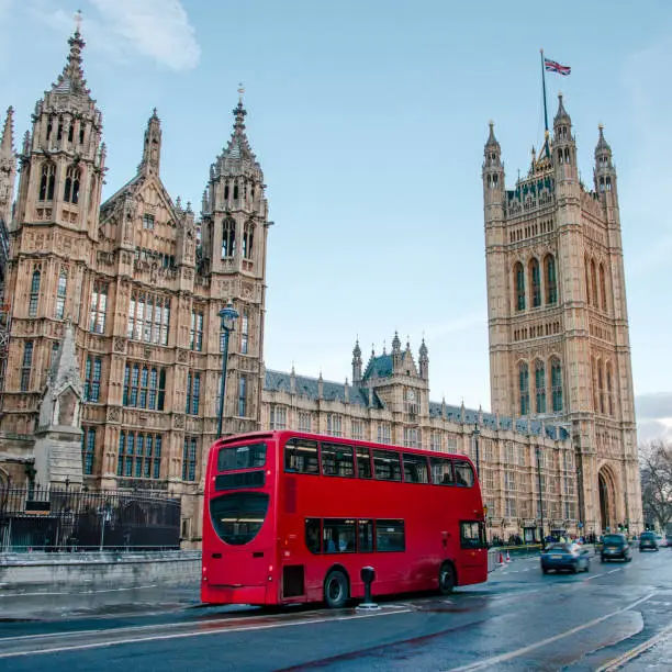 Houses of Parliament and red double-decker bus, London