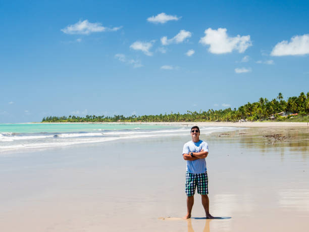 man standing at beach view on a summer day, Maragogi, Alagoas