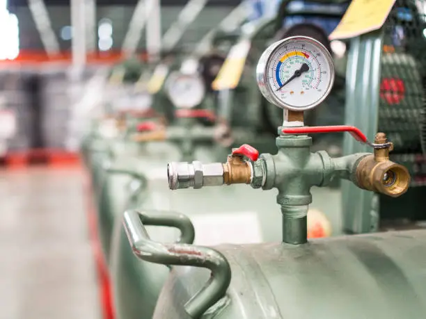 Photo of Air tank with pressure gauge.