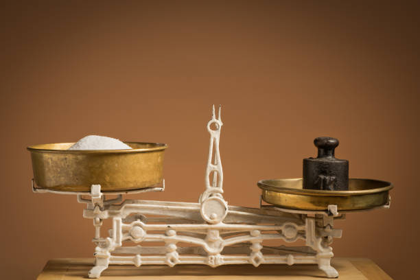 istock Old white vintage kitchen scale, brass with weights and sugar 928458636