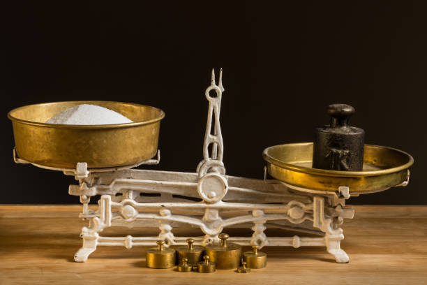 istock Old white vintage kitchen scale, brass with weights and sugar 928458860