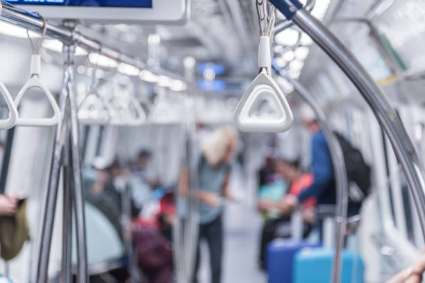 istock Handhold in subway with blur background people in subway 928465424