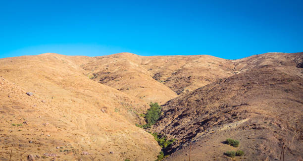 istock Desert road with Atlas Mountains, Morocco 928465480