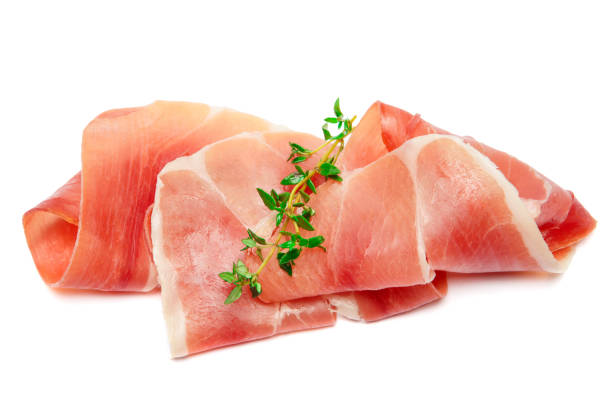 istock Italian prosciutto crudo or spanish jamon. Raw ham on white background. 928465818