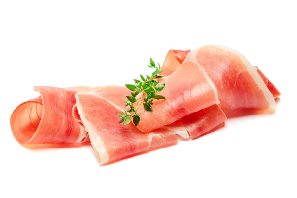 istock Italian prosciutto crudo or spanish jamon. Raw ham on white background. 928465886