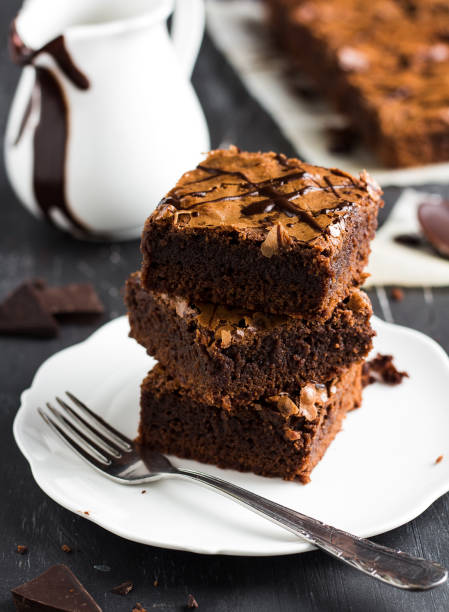 istock Chocolate brownie cake piece stack on plate homemade pastries 928466444