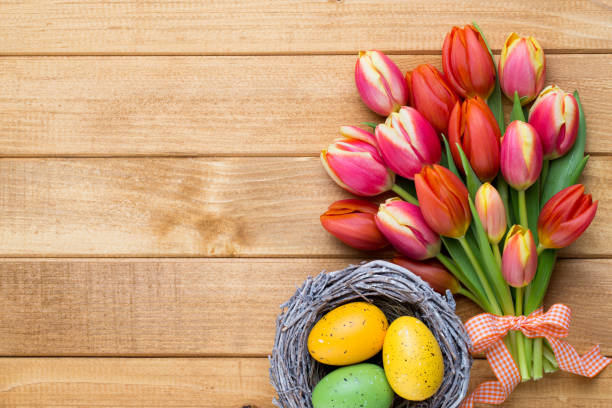 istock Spring easter tulips in bucket on wooden vintage background. 928466738