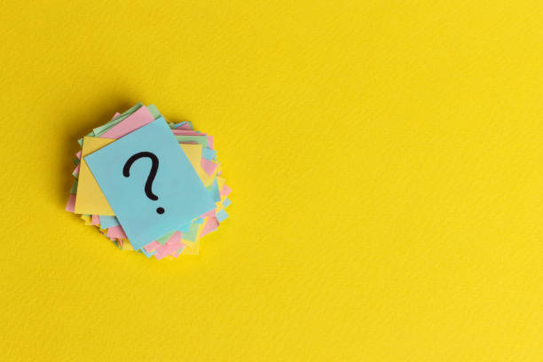 istock question marks written reminders tickets on yellow paper background 928469742