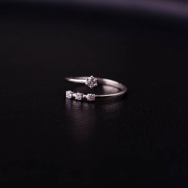 istock Fine silver jewelry on a black background with copy space 928470092