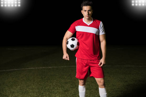 istock Player standing on soccer field 928470356