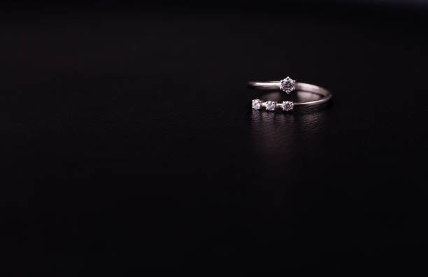 istock Fine silver jewelry on a black background with copy space 928470360