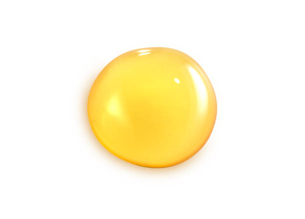 istock Macro one honey drops isolated on white background, File contains a clipping path. 928472668