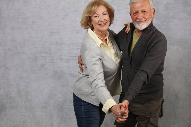 istock Happy senior couple dancing and laughing 928472856