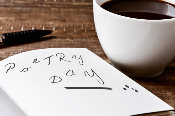 istock text poetry day in a notebook and a cup of coffee 928473632