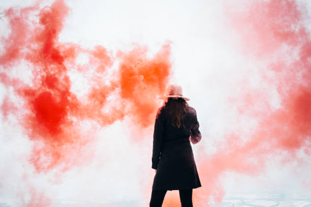 istock Hipster woman with smoke bomb 928477208