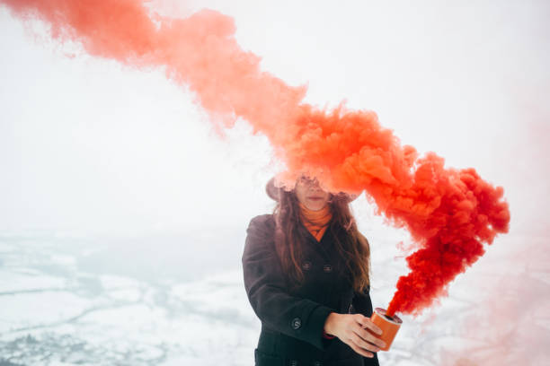 istock Hipster woman with smoke bomb 928477214