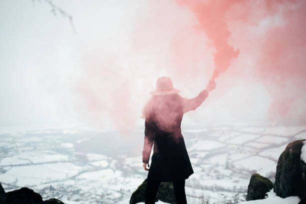 istock Hipster woman with smoke bomb 928477380