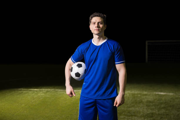 istock Soccer player in blue jersey on football pitch 928477708