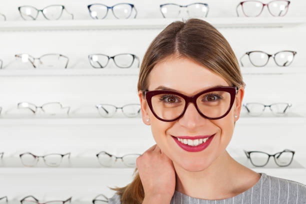 istock Young woman choosing eyeglass frame 928478000