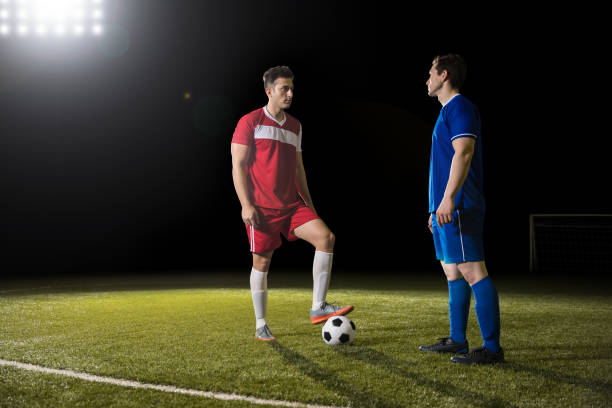 istock Soccer team opponents playing football 928478584