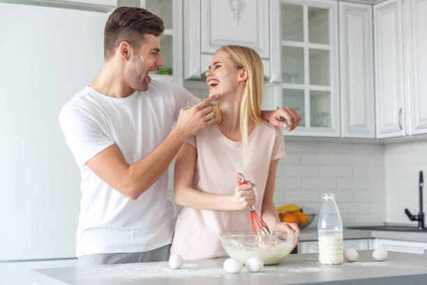 istock loving couple cooking breakfast together on kitchen on weekend morning 928478900