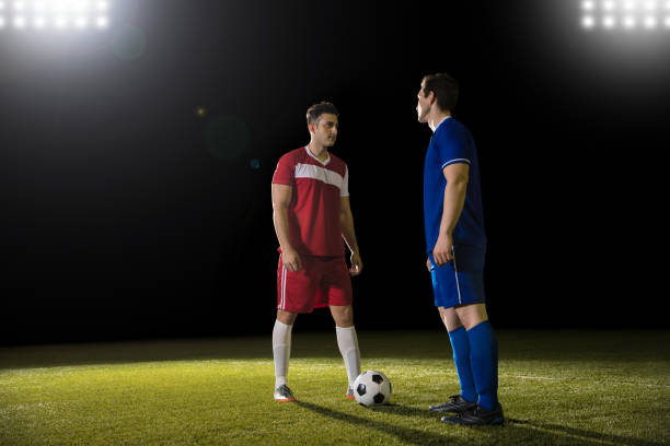 istock Football players in a challenge up position 928478916