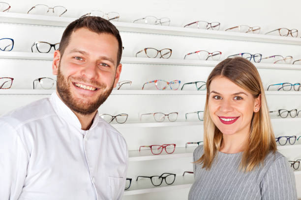 istock Ophthalmologist and beautiful patient in optical store 928482150