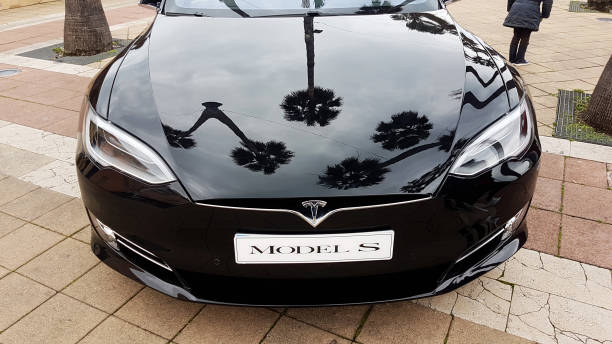Black Tesla Model S Electric Car - Front View Menton: Black Tesla Model S (Front View) Electric Car Parked on a Square in Menton on The French Riviera. The Tesla Model S is a Luxury Full-Sized Electric Five Door 2018 stock pictures, royalty-free photos & images