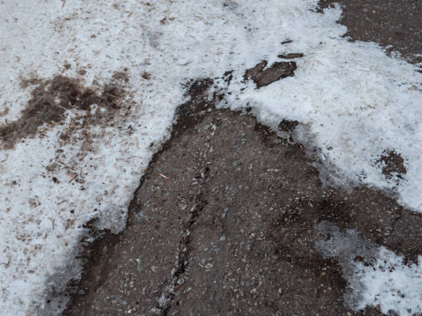 istock snow shoveled in driveway 928490828